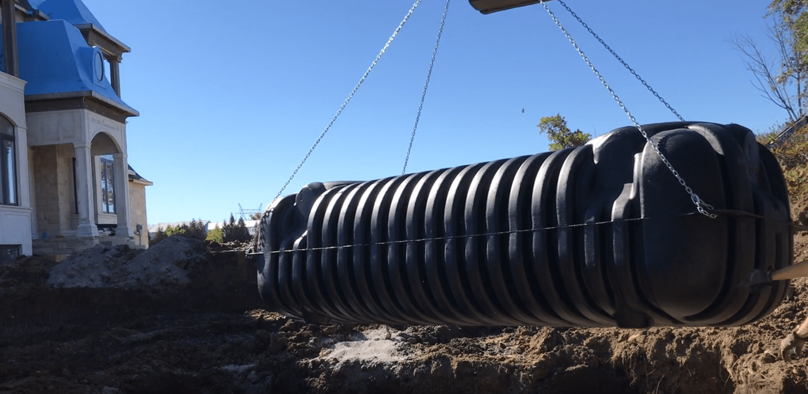 Crane Lifting Underground Tank onto Site